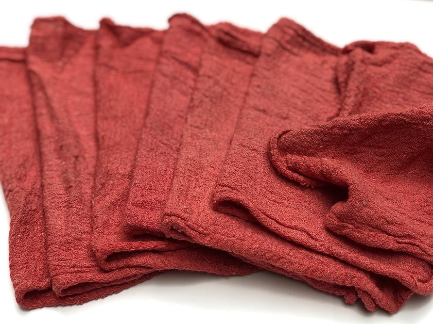 Pile of red reusable cloth shop towels